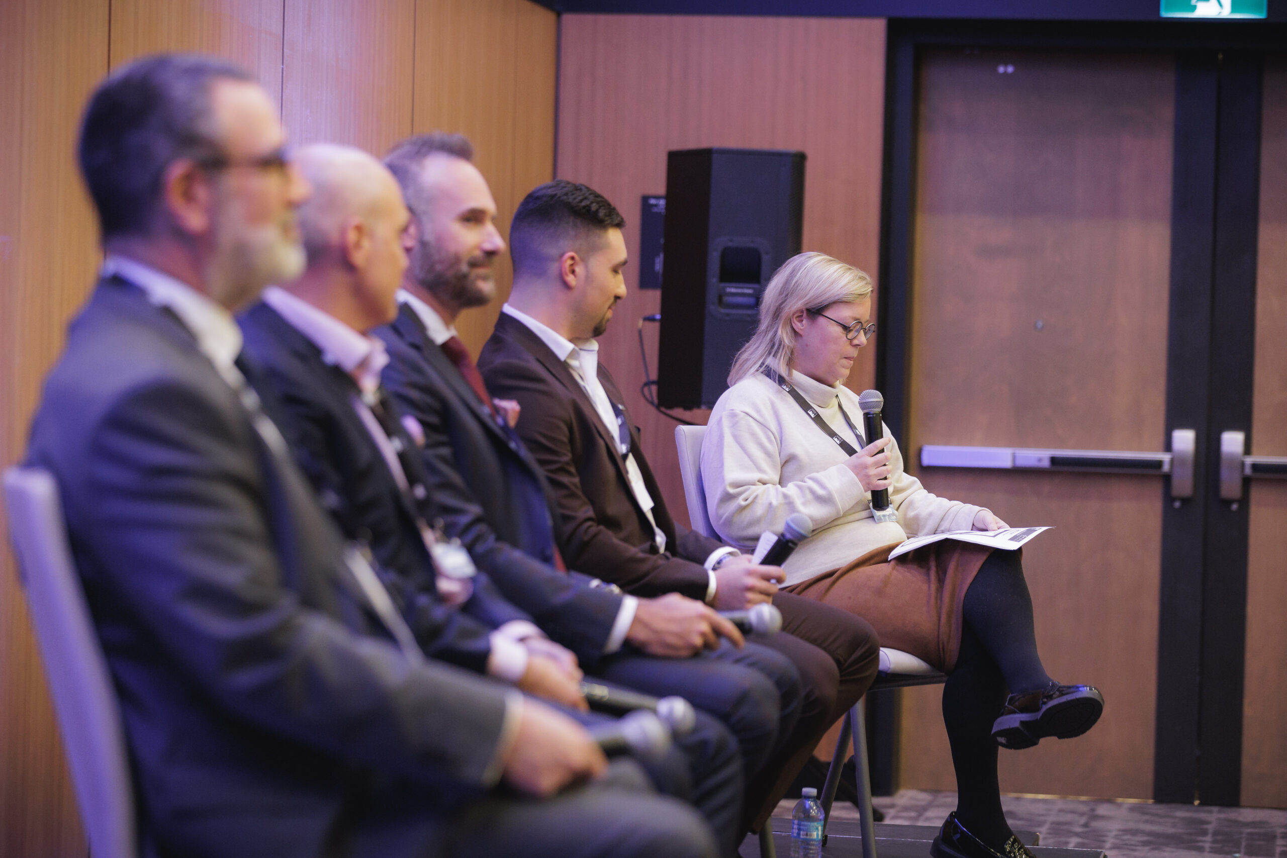 Panel of experts discussing the housing crisis at CRECTalk 1, including Michael C. Williams, Amine Menard, Peter Picciola, and Aubie Herscovitch, moderated by Andreanne Lavallee.